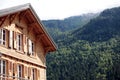 European alpine ski chalet hotel, view of the Alps in distance Royalty Free Stock Photo