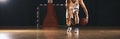 European Basketball Player Bouncing Ball on Wooden Court