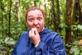 European Biologist Biting A Grain Of Tagua