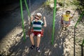 European boy on chain swing. Summer leisure time concept Royalty Free Stock Photo