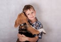 European boy hugging a dog a Beagle Royalty Free Stock Photo