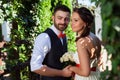 European bride and groom kissing in the park