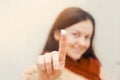 European brunette girl, finger in cream concept of beauty. isolated background Royalty Free Stock Photo