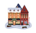 European building exterior with Christmas decoration. House facade with Xmas, winter holiday decor, snow on gable roof