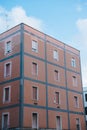 european building with shuttered windows under blue sky,