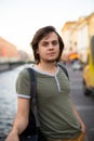 European Caucasian White Young Male Man With Medium Length Hair In Old Historical City St. Petersburg, River Channel. Lifestyle