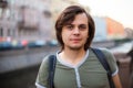 European Caucasian White Young Male Man With Medium Length Hair In Old Historical City St. Petersburg, River Channel. Lifestyle
