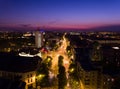 European city skyline seen by a professional drone at night