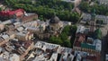 European City in spring. Densely populated areas of the city. Panorama of the ancient town. Aerial Roofs and streets Old