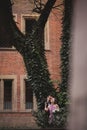European couple, bride and groom kissing in the park near big tree Royalty Free Stock Photo