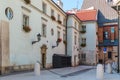 European courtyard - a white house, the windows of which are dec