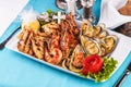 Fried fish, king prawns with lemon, mussels with oyster sauce, colmar rings, crab meat Royalty Free Stock Photo