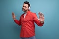 European dark-haired 35 year old man enjoys listening to his favorite music playing from headphones Royalty Free Stock Photo
