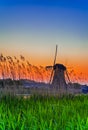 European Destinations. Traditional Romantic Dutch Windmill in Kinderdijk Village in the Netherlands At Dusk Royalty Free Stock Photo