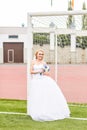 European Football Championship concept. Bride on the football stadium. Royalty Free Stock Photo