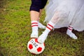 European Football Championship concept. Bride and groom on the football stadium. Royalty Free Stock Photo