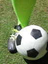 European Football Soccer Player`s Foot Next to Soccer Ball 2 Royalty Free Stock Photo