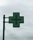 European green cross pharmacy store sign: Farmacia. Pharmacy sign. Royalty Free Stock Photo