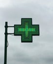 European green cross pharmacy store sign: Farmacia. Pharmacy sign. Royalty Free Stock Photo