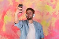 European guy have fun time. American handsome bearded guy with headphones.