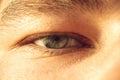 European guy`s eye close up. part of the face macro. the eyeball is extremely close. Human pupil Royalty Free Stock Photo