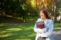 European happy freelancer girl holding notepad and laptop