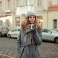 European happy woman in stylish fashion knitted clothes with