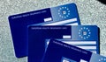 European Health Insurance Cards EHIC which covers you against illness or injury when abroad. Close up image of three cards. Fiel