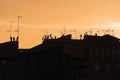 European historical ancient city skyline, rooftops with antenna silhouette at dusk Royalty Free Stock Photo