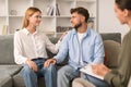 European husband and wife reconciling after marriage therapy session indoor Royalty Free Stock Photo