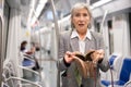 Senior woman was robbed in subway train Royalty Free Stock Photo