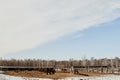 European landscape in March: on fields snow starts to thaw.