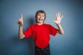European-looking boy of ten years shows a figure Royalty Free Stock Photo