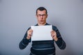 European-looking man 30 years holding a blank Royalty Free Stock Photo