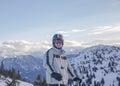 European Male Skier Using Action Camera On Top Of Mountain