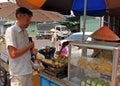 European man eats in the Asian market