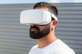 European man guy use computer technology person wear VR headset virtual reality goggles exploration metaverse modern Royalty Free Stock Photo