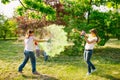 European people celebrate Indian holi festival with colorful paint powder on faces and body.