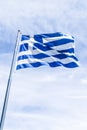 Greek flag and cloudy sky in summer day, politics of Europe