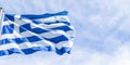 Greek flag and cloudy sky in summer day, politics of Europe