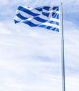 Greek flag and cloudy sky in summer day, politics of Europe