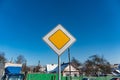 European priority road sign, sign main road on blue sky background Royalty Free Stock Photo