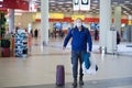 European redbeard man is in protective medical mask in airport