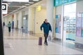 European redbeard man is in protective medical mask in airport