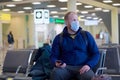 European redbeard man is in protective medical mask in airport