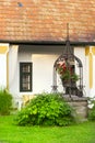 European rural house garden fountain. Royalty Free Stock Photo