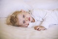 European small child lying on the bed