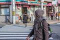 European tourist crossing road. Walking around Kyoto at sunny winter day. Royalty Free Stock Photo