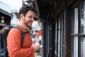 European tourist eating a nikuman standing at a japanese street in Takayama. Royalty Free Stock Photo