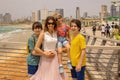 European tourist family with children, visiting Tel Aviv, Israel, enjoying day walk Royalty Free Stock Photo